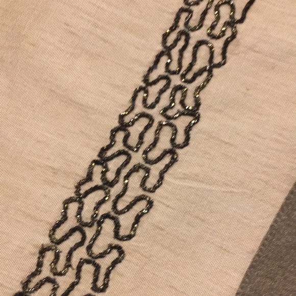 Table runner with embellishment. One small spot. 71” Tan with shimmer brown trim - Picture 3 of 4